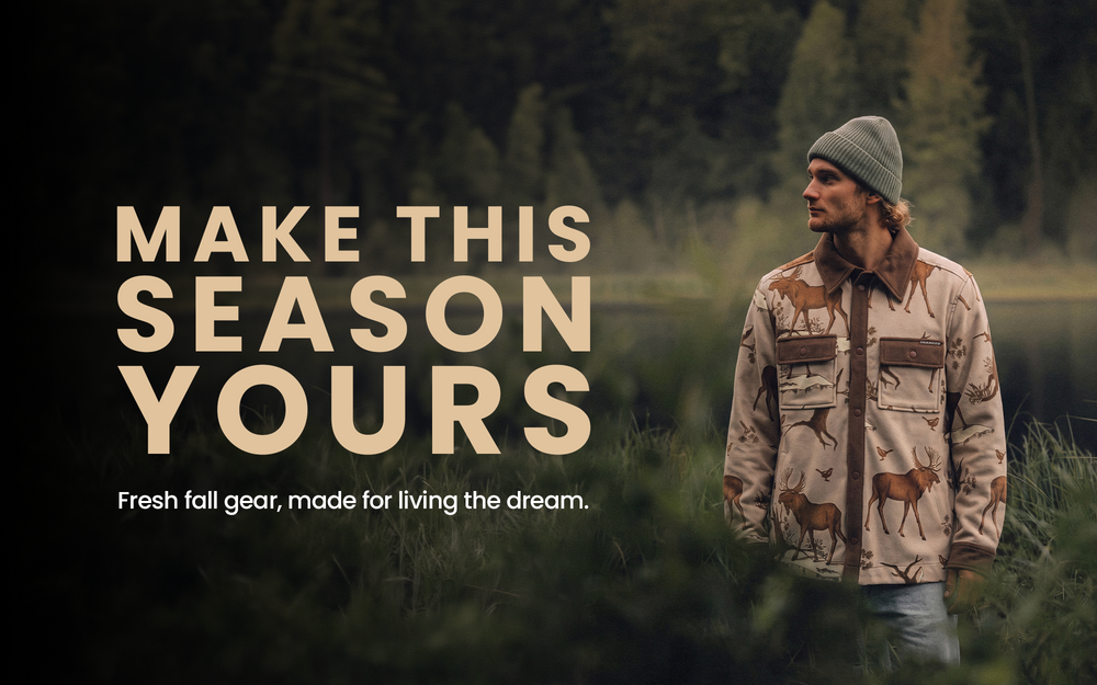 Man in a TEAMLTD fall jacket by a lake
